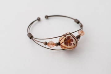 Bracelet with stones. Bracelet of imitation jewelry, isolated on white background