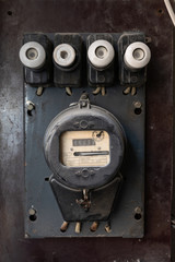 Vintage household electric energy meter with electric fuses , close up
