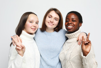 Close-up portrait of three multiracial, african american and european girls.