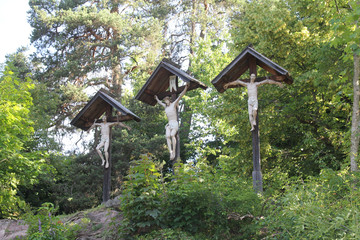 Crucifixion carvings on trail in Kastelruth (Castelrotto)