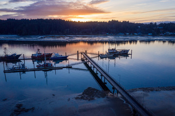 Aerial of boats in Charleston, Oregon, which is a little fishing village near Coos Bay. Taken during evening hours. 