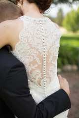 Close up of back of lacy wedding dress