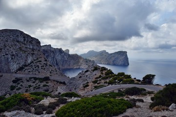 Fototapeta na wymiar Amazing landscape when driving on an open coastal road winding through to lighthouse Cap Formentor
