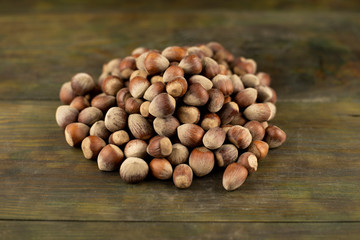 Hazelnuts on a wooden background