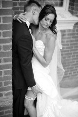 groom kissing sexy bride on neck