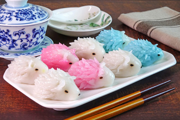 Dumpling : Cute porcupine shaped dumpling, delicious traditional asian food.(Chinese dumpings or Jiaozi) / Dim Sum : Colorful Porcupine shaped Dim Sum.