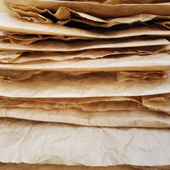 Empty brown paper bag from top view looking down inside at bottom.