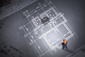 Man engineer thinking over his plan. Mixed media