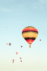 Colorful hot air balloons flying in the distance