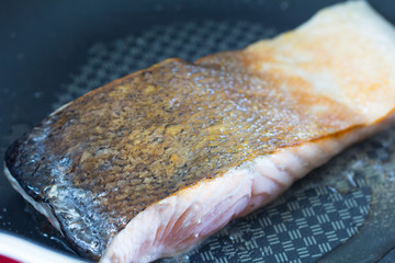 Grilled salmon fillets in the pan.