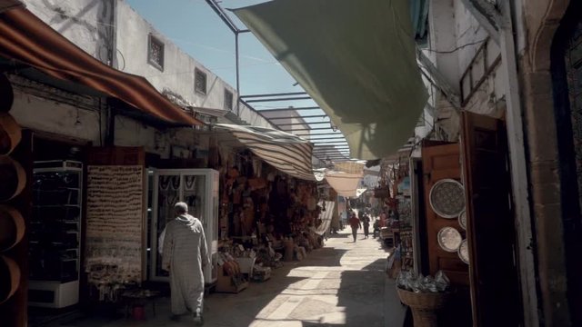 Slow motion of ancient marketplace in Marrakech Morocco.