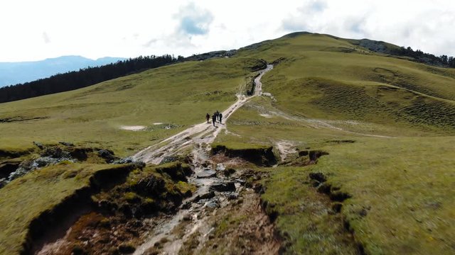 Epic Aerial View of Group Hiking Trail on Mountain Ridge - Drone Shot 4K
