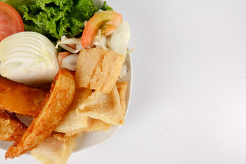 Fish and Chips with vegatables isolated on white.