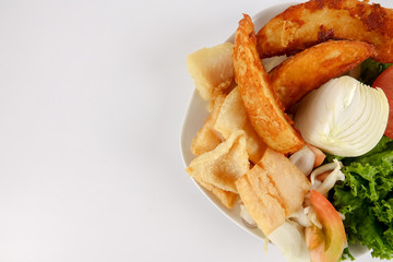 Fish and Chips with vegatables isolated on white.