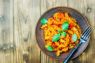 Pasta with sausage in tomato sauce, italian food