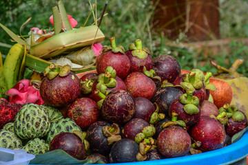 Fresh organic mangosteen fruits at market