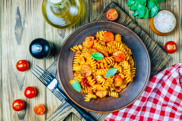 Pasta with sausage in tomato sauce, italian food