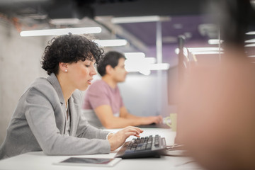 female software developer using desktop computer