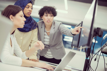 multiethnics team of software developers working together