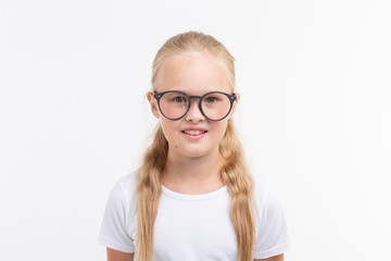 Fototapeta premium Beautiful child girl with glasses isolated on white