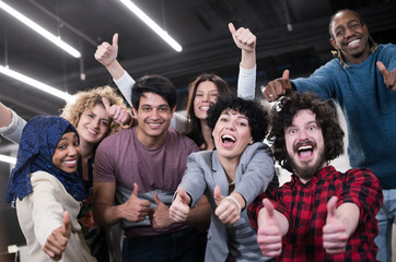 portrait of young excited multiethnics business team