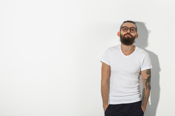 Beauty, fashion and people concept - Close up portrait of hipster man with beard over white background