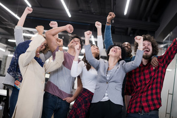 portrait of young excited multiethnics business team