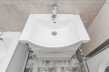 The photo of a sink in a bathroom