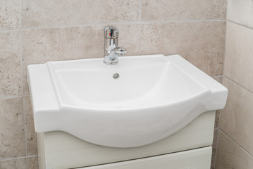 The photo of a sink in a bathroom