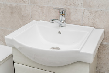 The photo of a sink in a bathroom