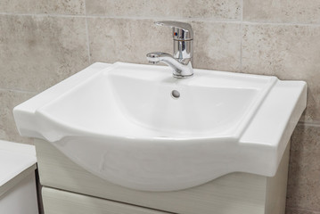 The photo of a sink in a bathroom