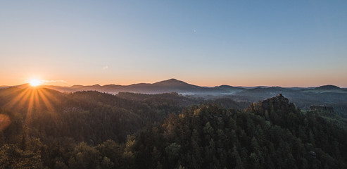 Summer landscape in mountains with the sun
