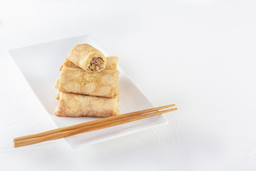 Chinese tortillas - bings in plate on a white background. Copy space