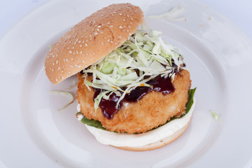  Fast food, delicious fish burger, beautifully laid out on a wooden background, for culinary design