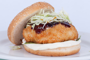  Fast food, delicious fish burger, beautifully laid out on a wooden background, for culinary design