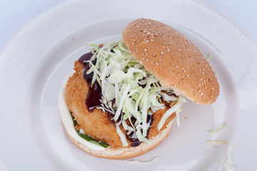  Fast food, delicious fish burger, beautifully laid out on a wooden background, for culinary design