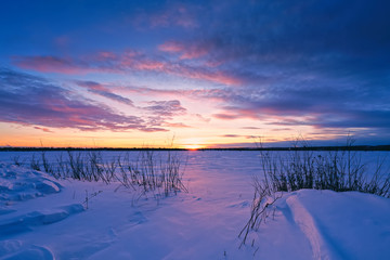 Beautiful sunset over frozen Lake