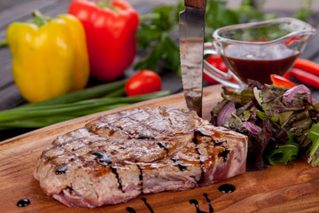  juicy and appetizing steak tamogavok of horse meat on the table, for design in cooking