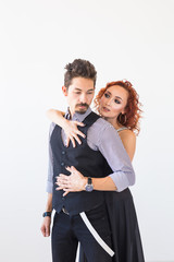 Social dance, bachata, kizomba, people concept - Young pretty woman in pink dress and man dancing waltz or salsa