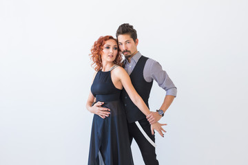 Social dance, kizomba, tango, salsa, people concept - beautiful couple dancing bachata on white...