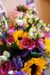 Bouquet of multicolored flowers on a dark background. Colorful bouquet of different fresh flowers. Rustic flower background. close-up