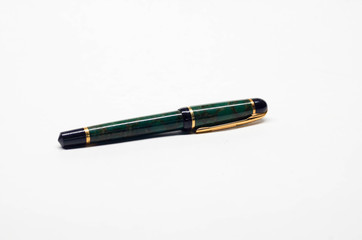 Classic fountain pen denoting status and formality when signing official documents. Cap on. 