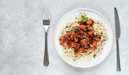 teriyaki chicken's  with chili pepper and sesame seeds, with rice. on a white plate, copy space, selective focus, Asian cuisine, Chinese cuisine, Thai cuisine. food flat lay. light background