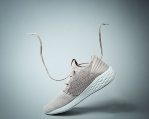 Running sports shoes with flying laces.