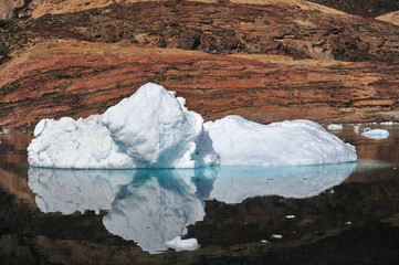 Icebergs, ocean, mountains. Near the coast of Greenland. Disco Bay.