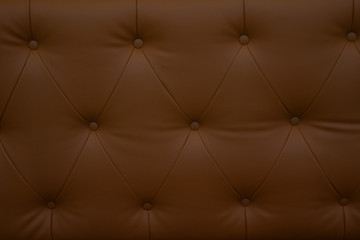 Close up brown leatherette sofa , close up modern sofa for background or texture.