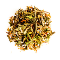 Aromatic crumbly Handful of Dry tea leaves isolated on white background. Green and black dry tea, isolated on white