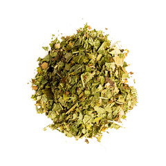 Aromatic crumbly Handful of Dry tea leaves isolated on white background. Green and black dry tea, isolated on white