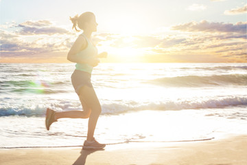 Fototapeta na wymiar Running woman on sea beach, motion. Girl jogging on sea coast in summer sunny morning. Fitness. Healthy lifestyle.