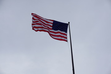 American flag waving in the sky